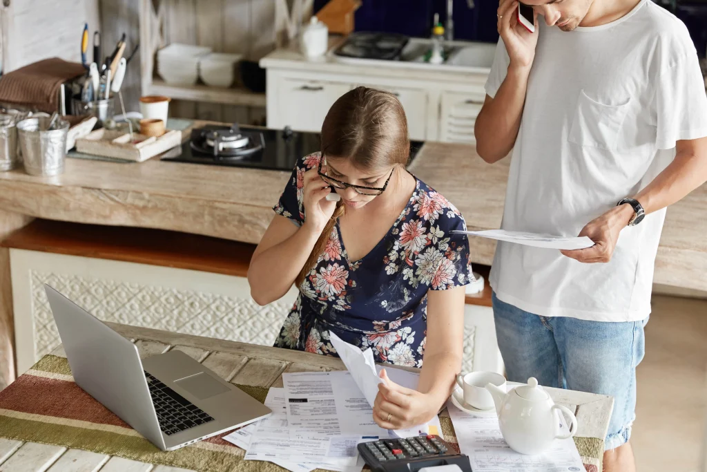 couple-managing-budget-together-kitchen-min | Homesell