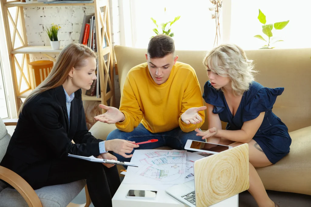 interior-designer-working-with-young-couple-lovely-family-professional-designer-architector-discussi | Homesell